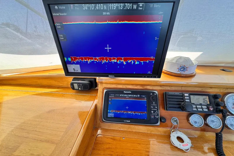 Slide: The Image of Boat dashboard with sonar display, Roughwater 41, 1978 model, showing depth and navigation instruments. - 45