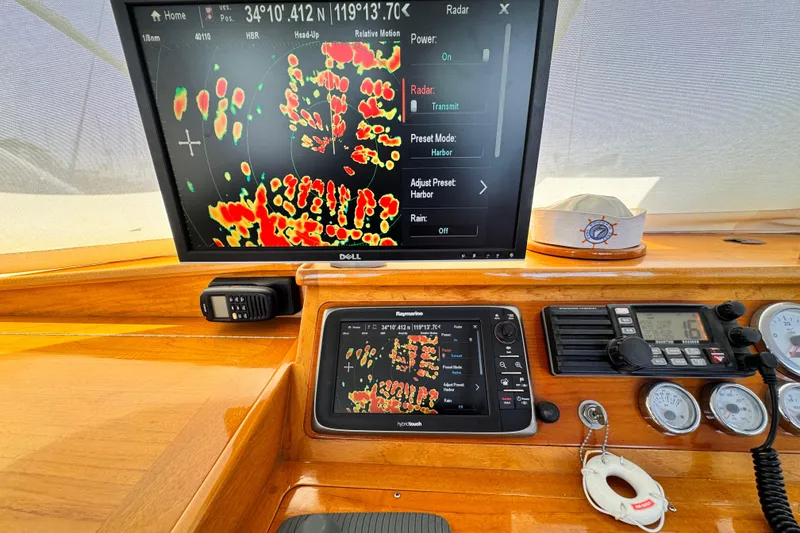 Slide: The Image of 1978 Roughwater 41 boat dashboard with radar and navigation equipment. - 46