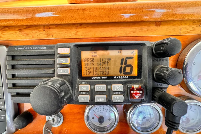 Slide: The Image of Standard Horizon radio on 1978 Roughwater 41 boat dashboard, displaying channel 16. - 48