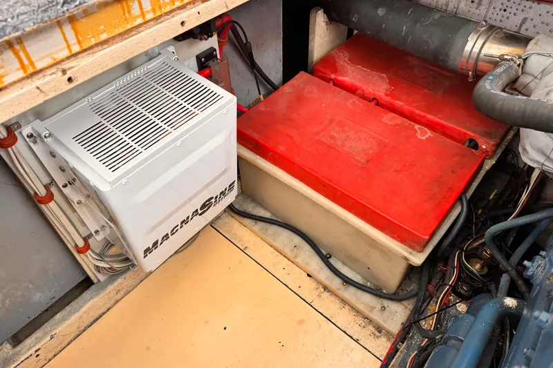 Slide: The Image of Electrical system in a 1978 Roughwater 41 boat, featuring a Magnum inverter and battery setup. - 55