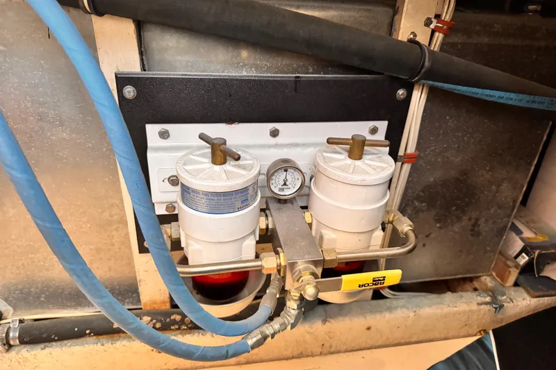 Slide: The Image of Diesel fuel filter system in a 1978 Roughwater 41 boat engine compartment. - 56