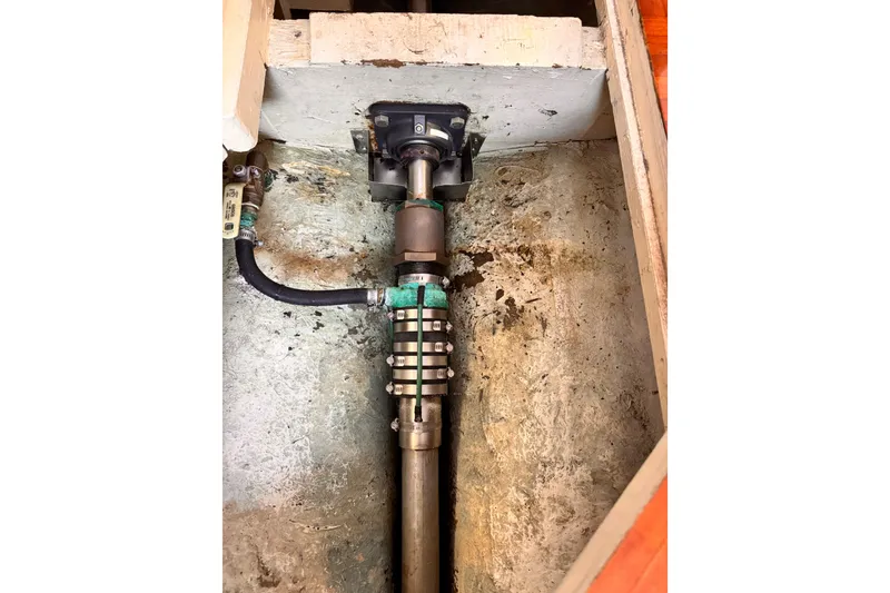 Slide: The Image of 1978 Roughwater 41 boat shaft and coupling in engine compartment. - 62