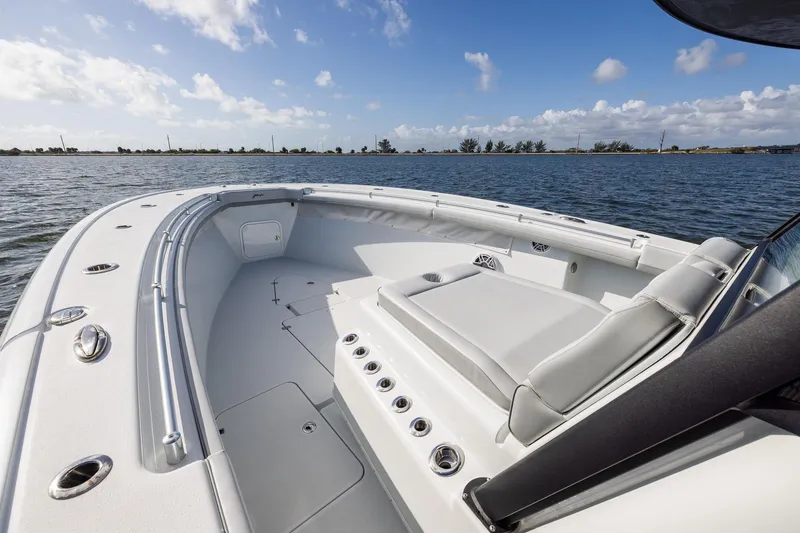 Slide: The Image of 2023 Yellowfin 42 Offshore boat on calm water under a blue sky. - 11