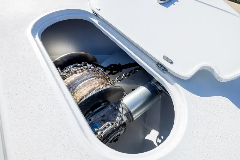 Slide: The Image of Anchor storage compartment on 2023 Yellowfin 42 Offshore boat, featuring chain and rope. - 13