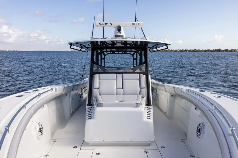 Slide: The Image of 2023 Yellowfin 42 Offshore boat on open water, featuring sleek design and advanced Garmin technology. - 19
