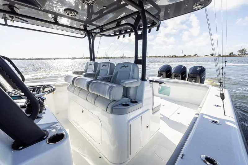 Slide: The Image of 2023 Yellowfin 42 Offshore boat interior with seating and multiple outboard engines. - 25