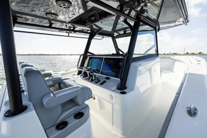 Slide: The Image of 2023 Yellowfin 42 Offshore boat interior with advanced navigation system and luxurious seating. - 27