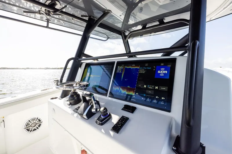 Slide: The Image of 2023 Yellowfin 42 Offshore boat dashboard with advanced navigation and control systems. - 28