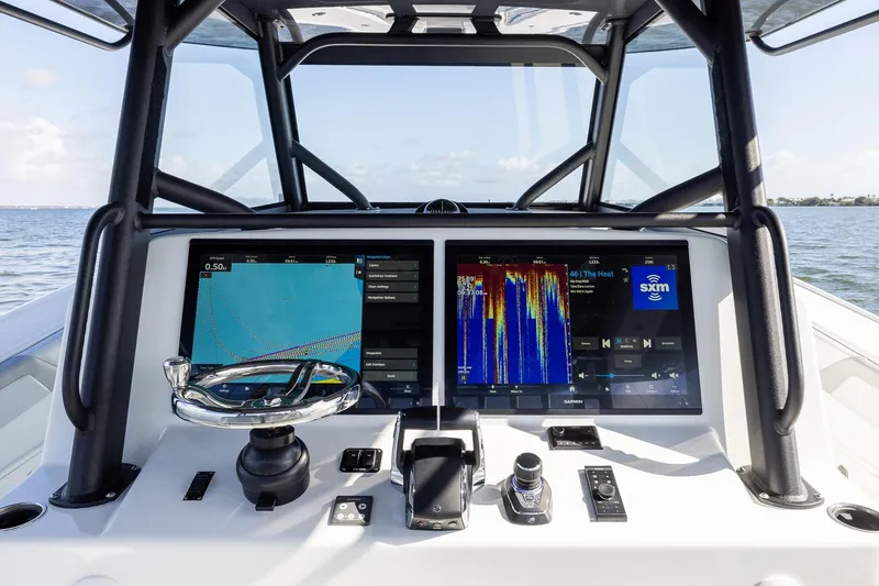 Slide: The Image of 2023 Yellowfin 42 Offshore boat dashboard with advanced navigation and control systems. - 29