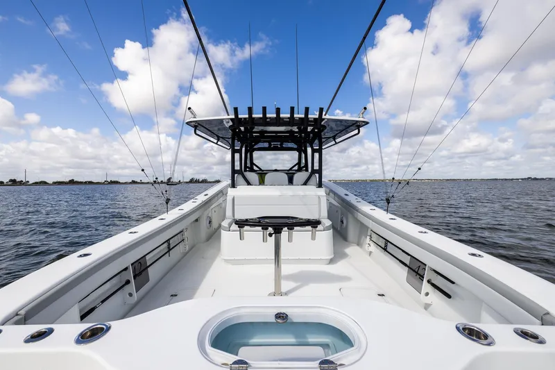 Slide: The Image of 2023 Yellowfin 42 Offshore boat on open water under a blue sky. - 30