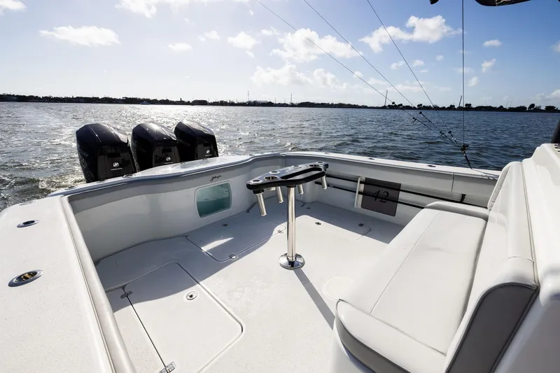 Slide: The Image of 2023 Yellowfin 42 Offshore boat with triple engines on open water. - 31