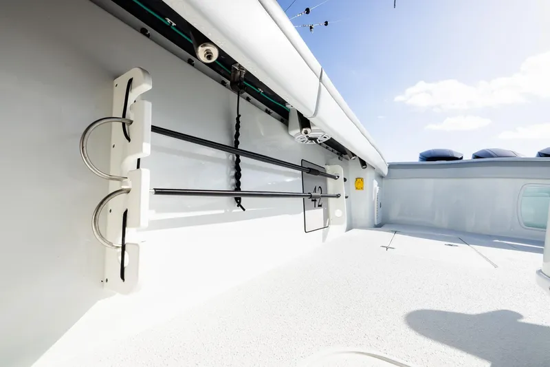 Slide: The Image of 2023 Yellowfin 42 Offshore boat interior with rod holders and sleek design. - 36