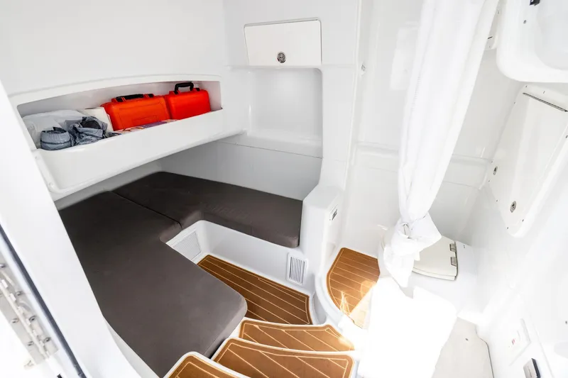 Slide: The Image of 2023 Yellowfin 42 Offshore cabin interior with seating and storage compartments. - 41