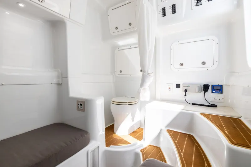 Slide: The Image of Interior of 2023 Yellowfin 42 Offshore boat with modern amenities and wooden accents. - 43