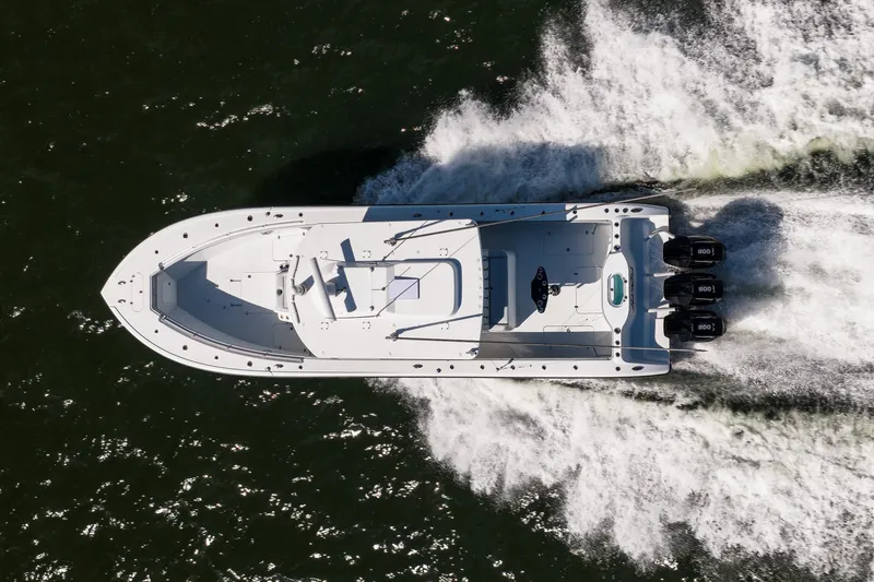 Slide: The Image of Aerial view of 2023 Yellowfin 42 Offshore boat speeding on water. - 7