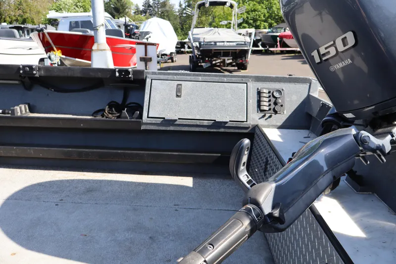 Slide: The Image of 2017 Alumaweld Super Vee LT boat with Yamaha 150 engine in a marina setting. - 6