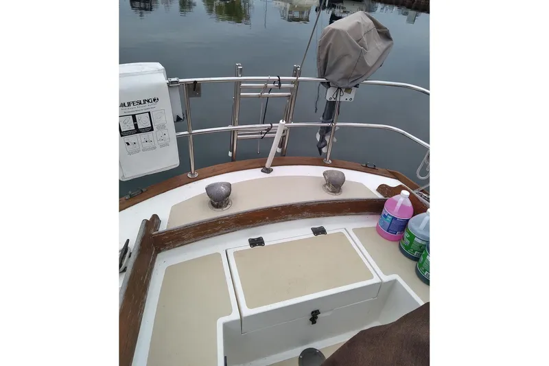 Slide: The Image of 1984 Cape Dory 31C sailboat cockpit with safety equipment and cleaning supplies. - 5