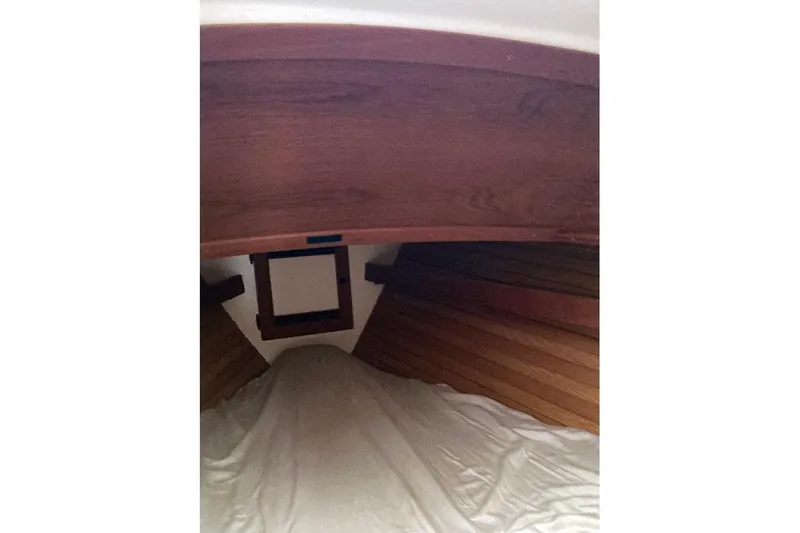 Slide: The Image of Interior cabin of a 1984 Cape Dory 31C sailboat with wooden paneling. - 9