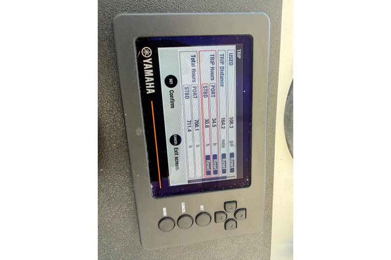 Slide: The Image of Yamaha display on 2003 Intrepid 323 Cuddy showing trip data and engine hours. - 33