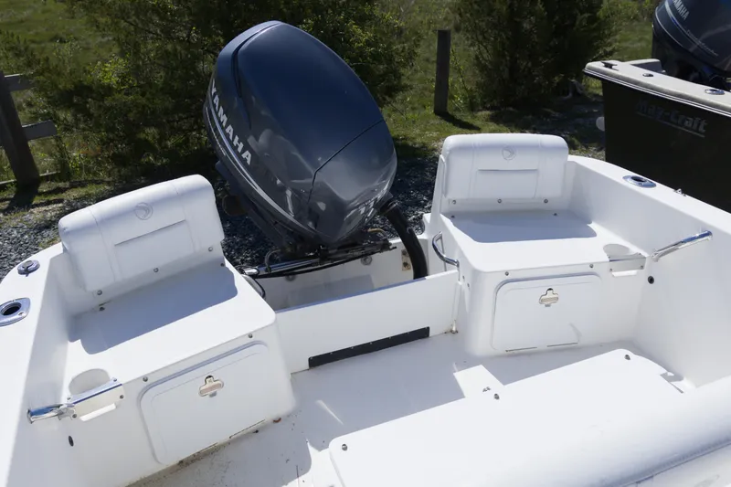 Slide: The Image of 2006 Edgewater 170CC boat with Yamaha outboard motor, featuring dual seating and storage compartments. - 10