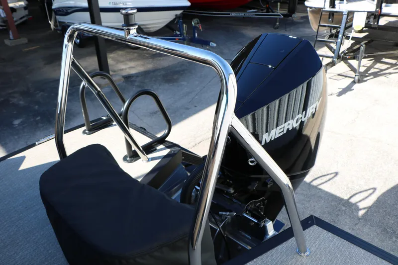 Slide: The Image of 2026 Evotti 525 QL Tri-Toon with Mercury outboard motor, featuring sleek chrome details. - 36