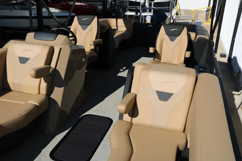 Slide: The Image of Luxurious interior of 2026 Evotti 525 QL Tri-Toon boat with beige seating. - 16