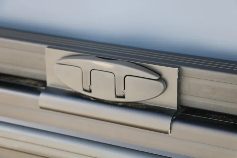 Slide: The Image of Close-up of Evotti 525 QL Tri-Toon 2026 boat latch mechanism. - 44