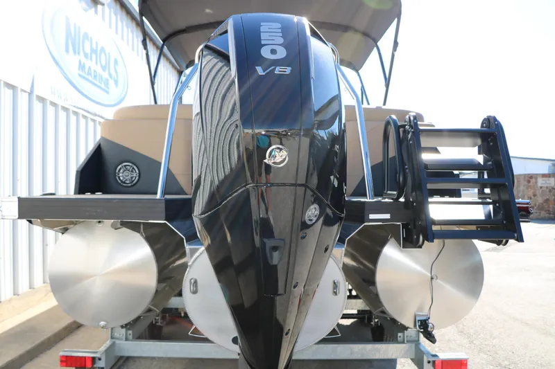 Slide: The Image of 2026 Evotti 525 QL Tri-Toon boat with powerful V8 engine, rear view. - 6