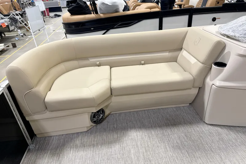 Slide: The Image of Luxurious seating on 2026 Godfrey EX 2286 SBX pontoon boat, featuring beige upholstery. - 3