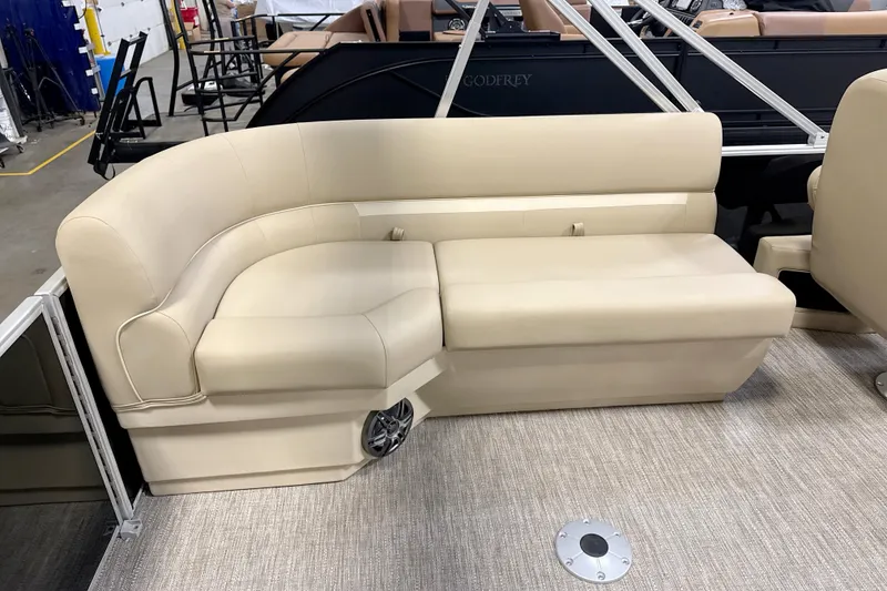 Slide: The Image of 2026 Godfrey EX 2286 SBX boat interior with beige seating and modern design. - 4