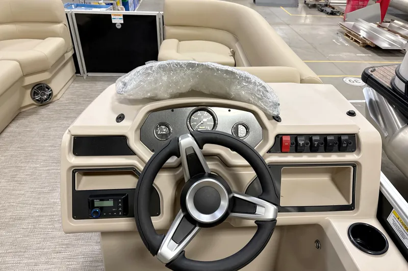 Slide: The Image of Steering console of 2026 Godfrey EX 2286 SBX pontoon boat with beige interior. - 6