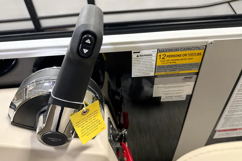Slide: The Image of Throttle control and capacity label on 2026 Godfrey EX 2286 SBX boat. - 7