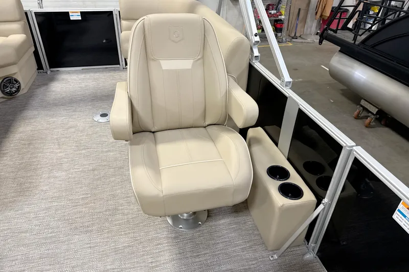 Slide: The Image of Beige captain's chair on 2026 Godfrey EX 2286 SBX pontoon boat with cup holders. - 9