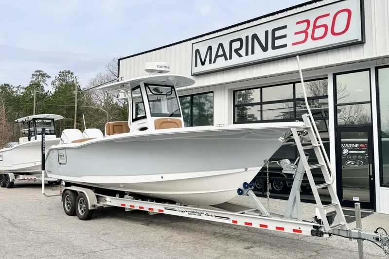 The Image of 2025 Sea Hunt Ultra 275 SE boat on trailer at Marine 360 dealership. - 1