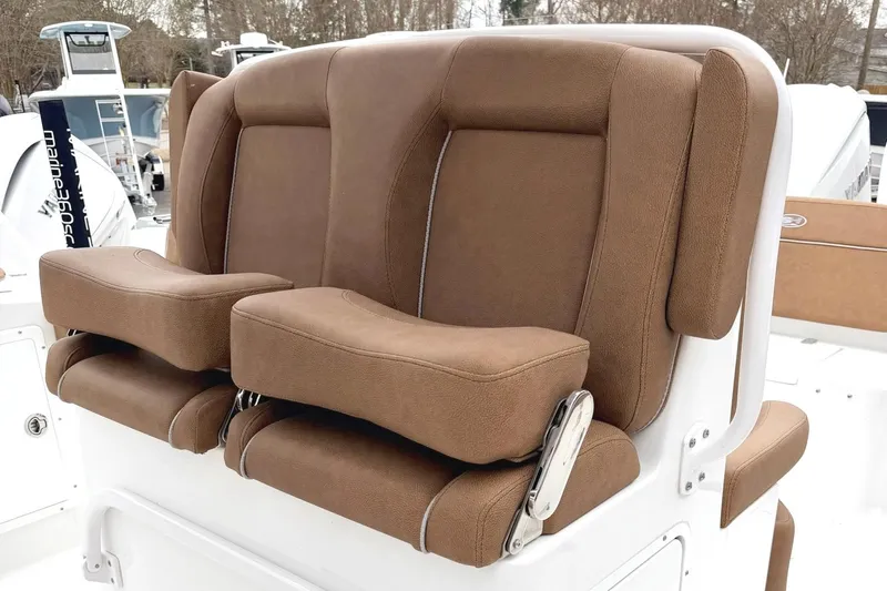 Slide: The Image of Brown cushioned seats on 2025 Sea Hunt Ultra 275 SE boat, showcasing comfort and style. - 11