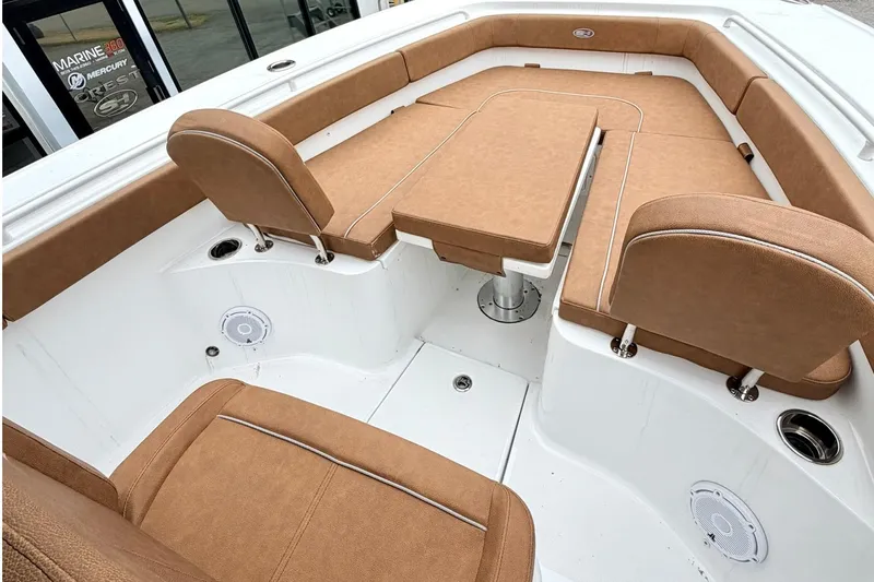 Slide: The Image of Luxurious seating area on 2025 Sea Hunt Ultra 275 SE boat, featuring tan upholstery. - 19