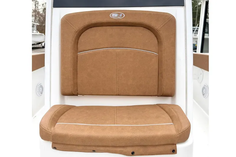 Slide: The Image of 2025 Sea Hunt Ultra 275 SE boat seat with tan upholstery and sleek design. - 20