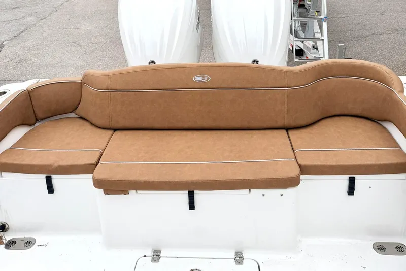 Slide: The Image of 2025 Sea Hunt Ultra 275 SE boat with tan cushioned seating. - 6