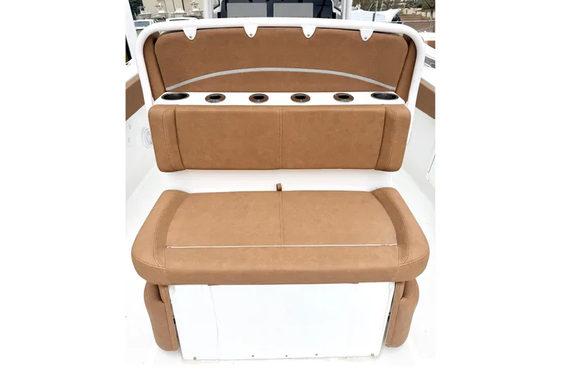 Slide: The Image of 2025 Sea Hunt Ultra 275 SE boat seating with cup holders, featuring tan upholstery. - 8