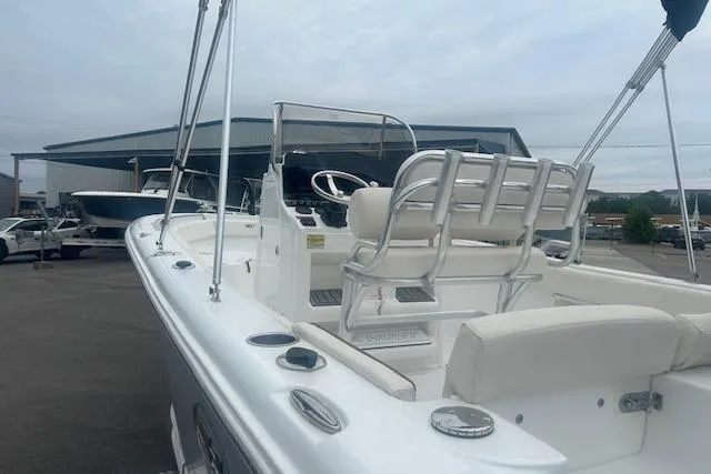 Slide: The Image of 2022 Sea Hunt Ultra 219 boat with white seating and steering console. - 7