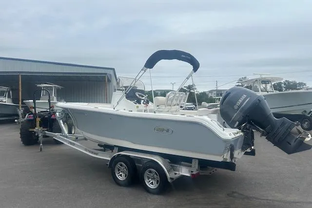 Slide: The Image of 2022 Sea Hunt Ultra 219 boat on trailer with Yamaha outboard motor. - 9
