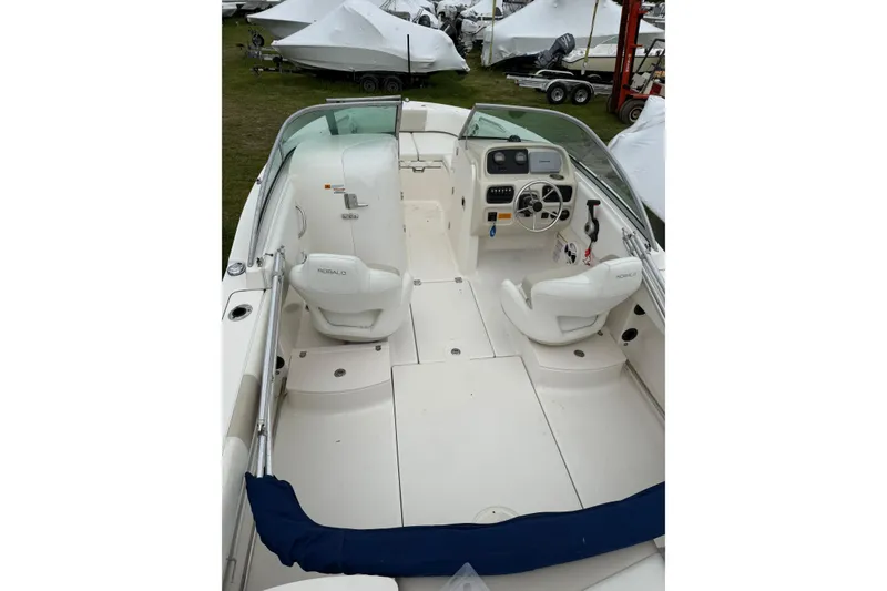 Slide: The Image of 2013 Robalo R207 Dual Console boat interior with steering wheel and seating. - 3
