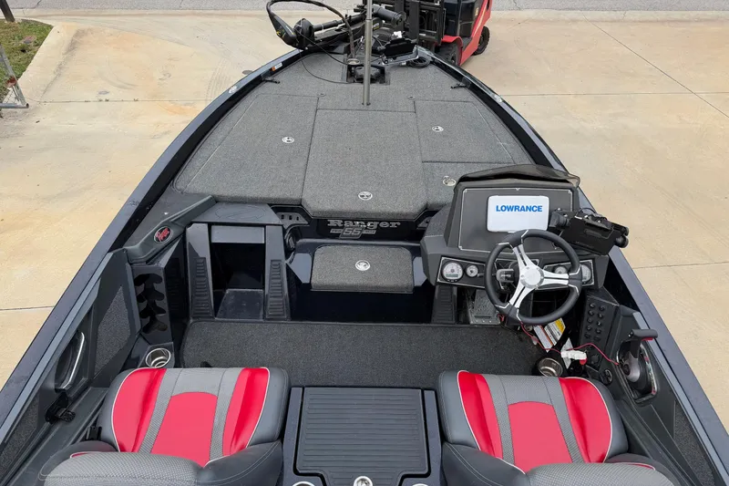 Slide: The Image of 2023 Ranger Z518 boat interior with Lowrance electronics and red-gray seating. - 7