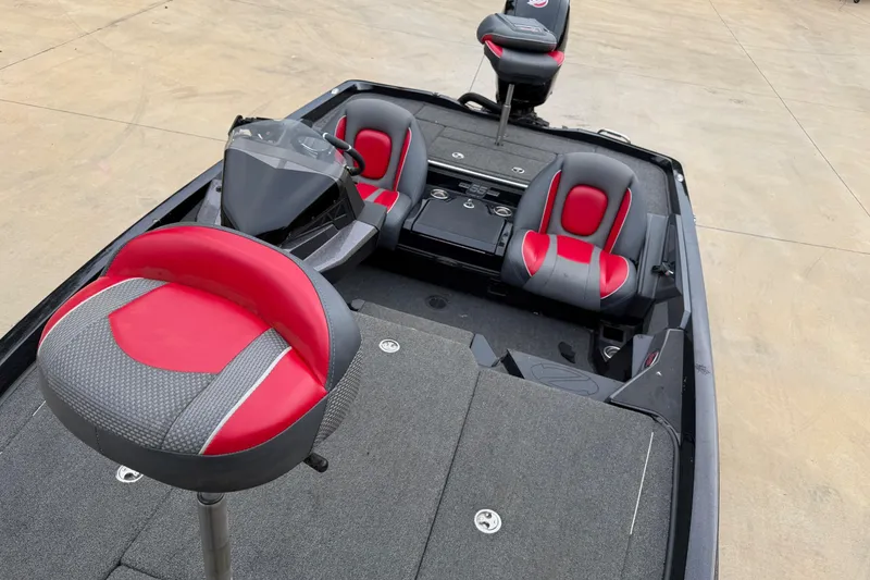Slide: The Image of 2023 Ranger Z518 boat interior with red and gray seating, showcasing modern design and comfort. - 8