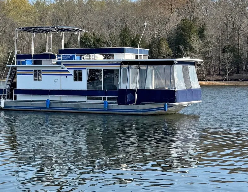 Slide: The Image of Sommerset Worlds Fair Edition 1984 houseboat on a tranquil lake. - 2