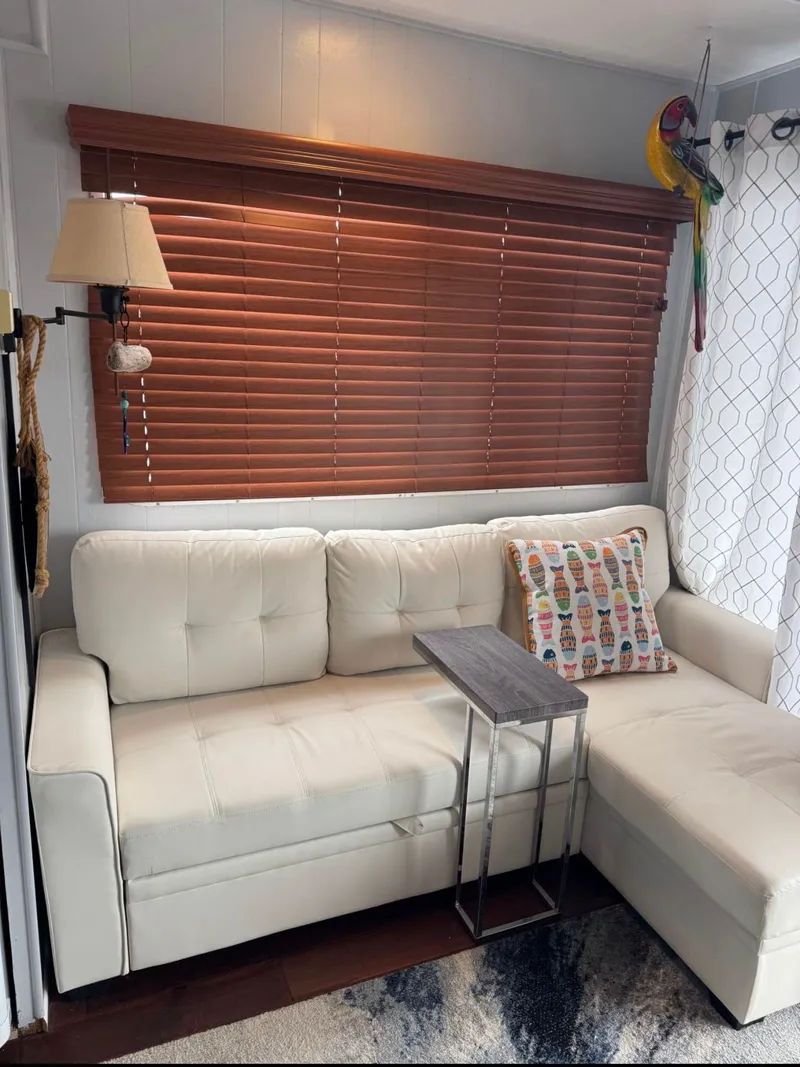 Slide: The Image of RV interior with white sofa and parrot, Sommerset Worlds Fair Edition 1984. - 5