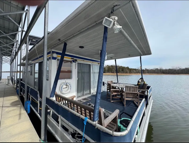 The Image of Sommerset Worlds Fair Edition 1984 houseboat docked by the lake. - 0