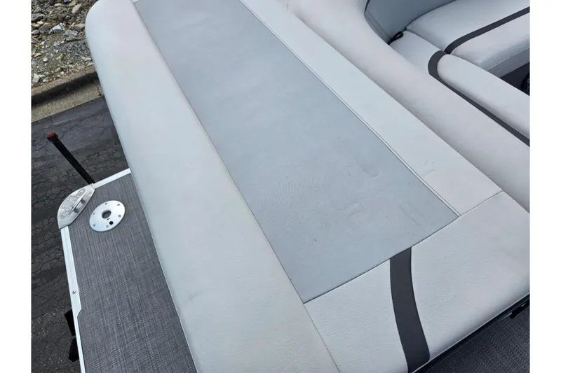 Slide: The Image of 2023 Crest Classic LX 200 boat interior with gray seating and deck details. - 16