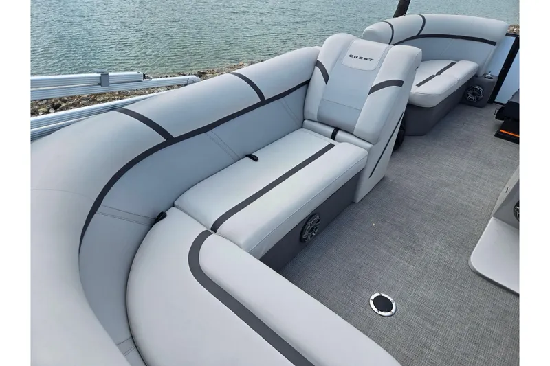 Slide: The Image of 2023 Crest Classic LX 200 boat interior with sleek gray seating and modern design. - 17