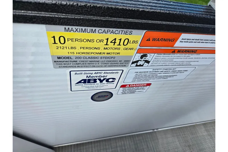 Slide: The Image of 2023 Crest Classic LX 200 capacity label, 10 persons or 1410 lbs, 115 horsepower motor. - 20